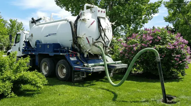 Professional vacuum truck performing residential drainage and septic maintenance in Reno, NV